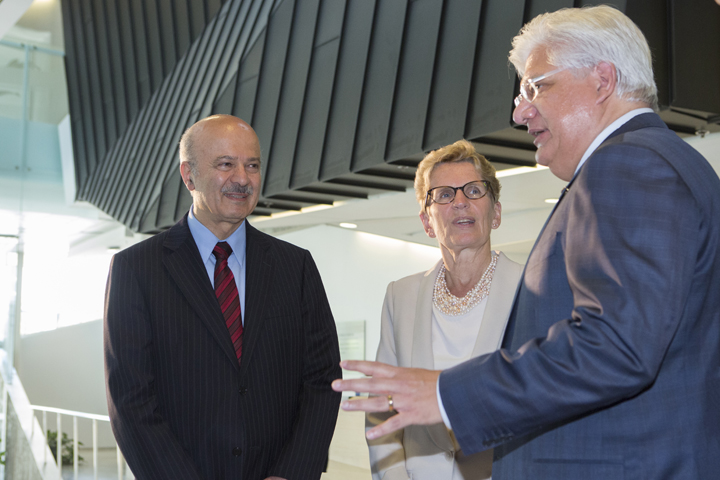 Science Minister Reza Morid, Ontario Premier Kathleen Wynne and Mike Lazaridis talking at Perimeter Institute