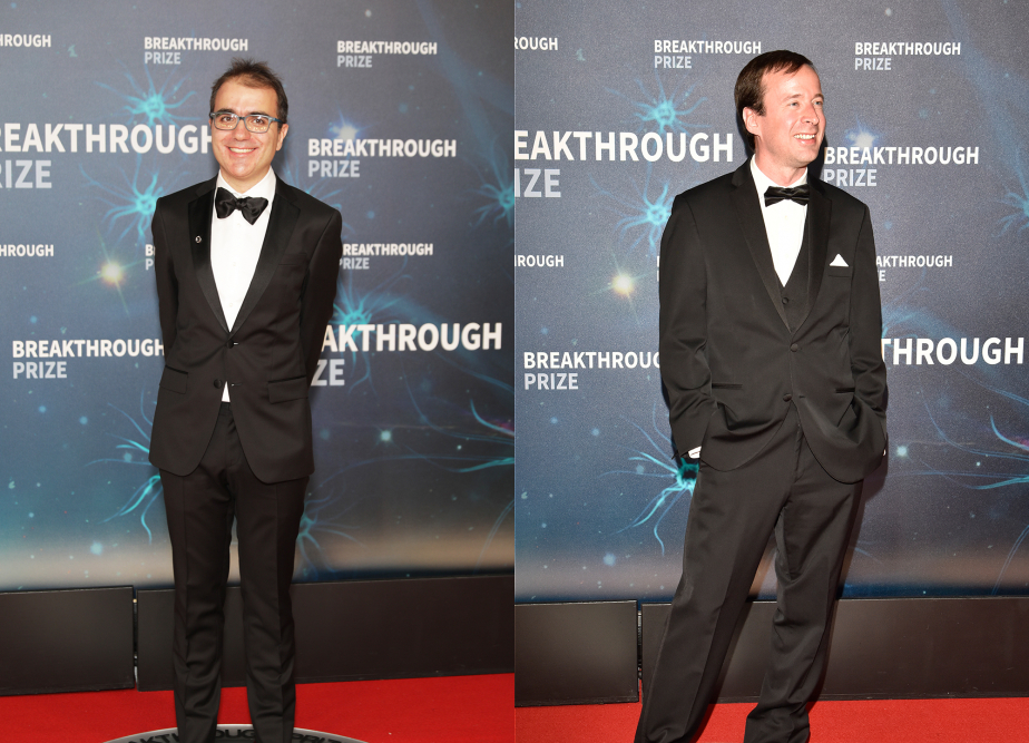 Portraits of Pedro Vieira and Kendrick Smith standing in front of the Breakthrough Prize banner at the awards ceremony in California.