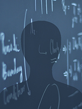 Equations on a chalkboard with a shadow outline of a person