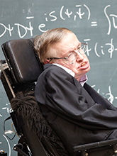 Disabled man in a wheelchair in front of a chalkboard of equations
