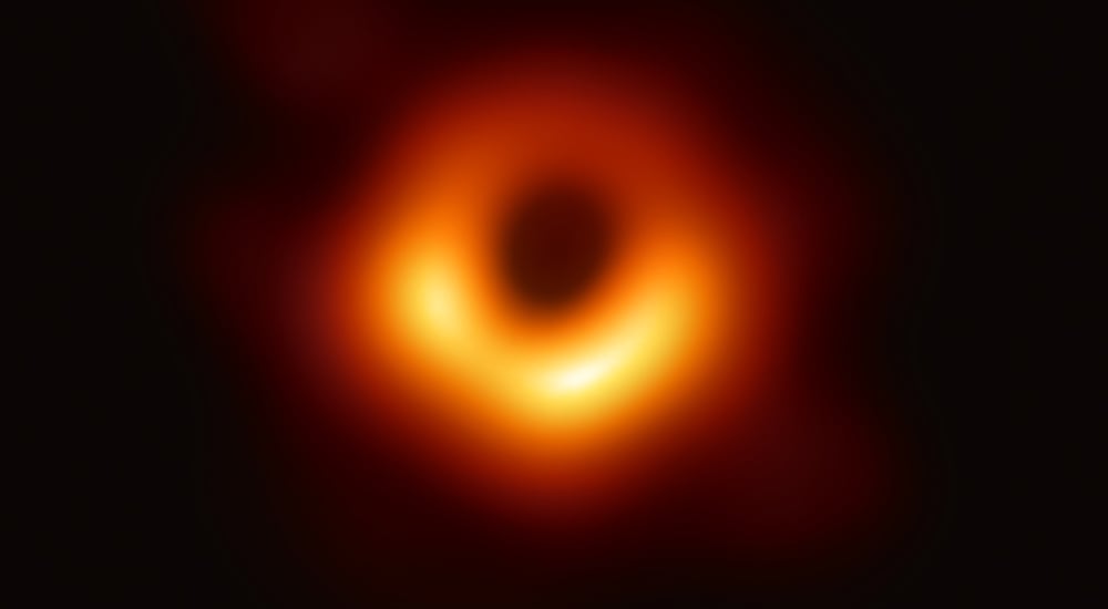 Scientific image of black hole on black background