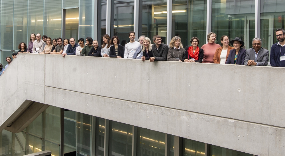 Group of people standing in a row along a staircase