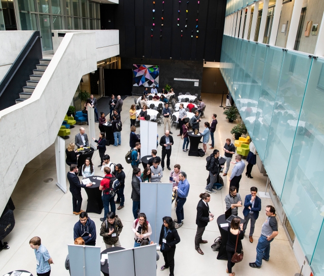 Aerial shot of groups of people interacting in an atrium