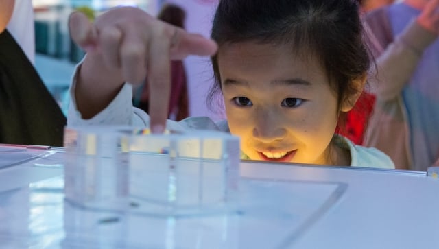 little girl making an experiment with wonder in her eyer at brainstem festival at Perimeter Institute