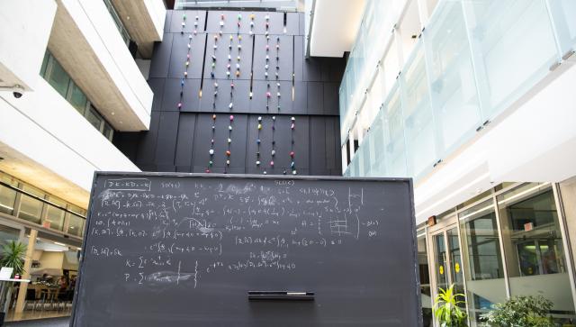 view of the atrium with a blackboard covered in equations