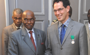 Neil Turok with Abdoulaye Wade, president of Senegal, after receiving the Ordre du Lion Medal