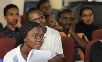 Students of the AIMS program listening to a lecture