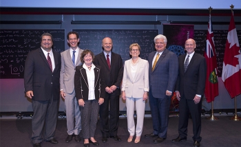 Group photo of Cosimo Fiorenza, Perimeter Board Vice-Chair;  Neil Turok, Director of Perimeter Institute; Kathryn McGarry, MPP for Cambridge and Minister of Natural Resources and Forestry; Reza Moridi, Minister of Research, Innovation and Science; Kathleen Wynne, Premier of Ontario; Mike Lazaridis, Perimeter Founder and Board Chair; and Michael Duschenes, Perimeter COO