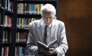 Man reading in library 